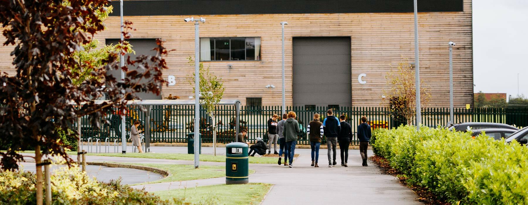 Riseholme College students walking toward engineering workshop